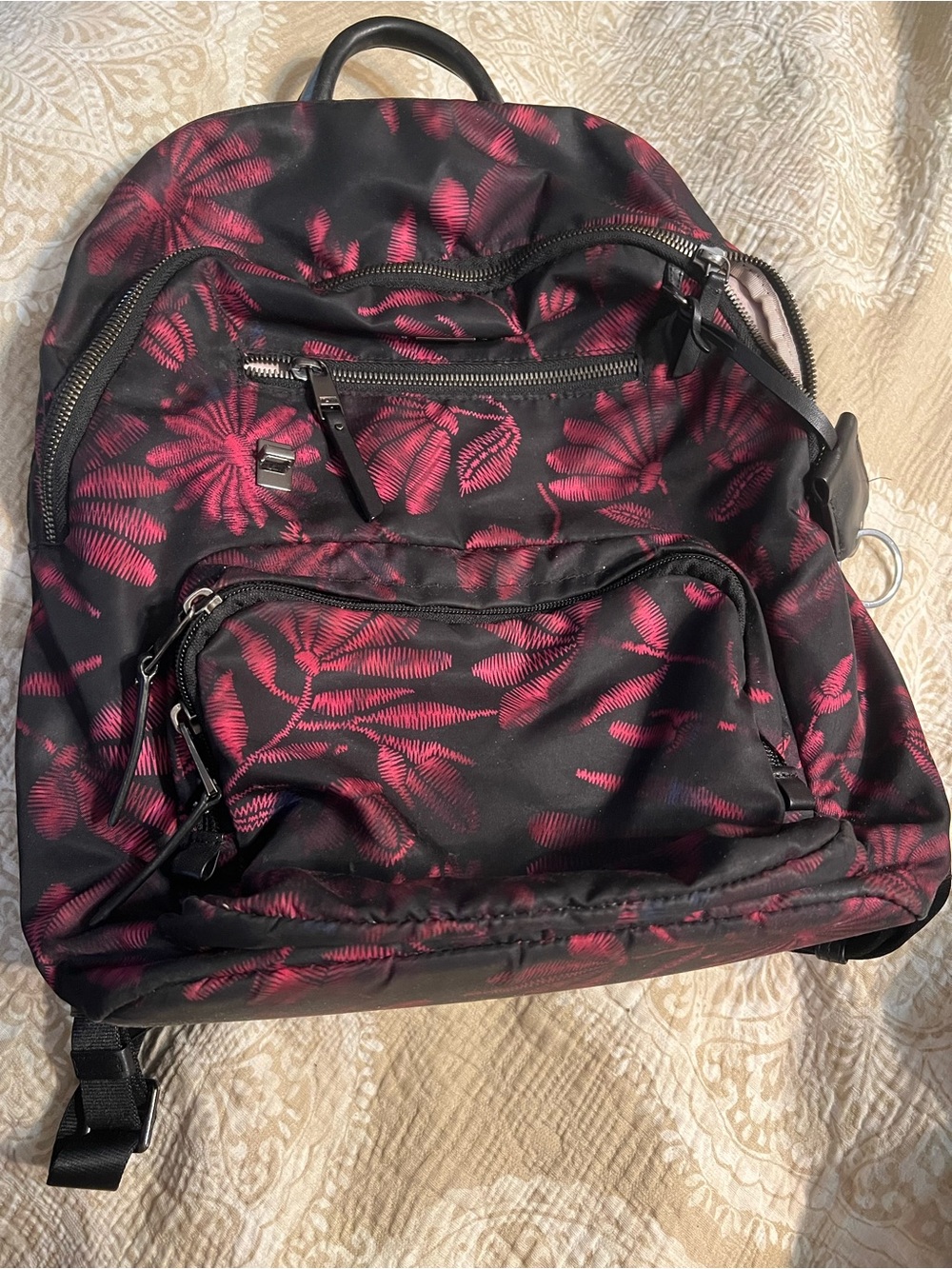 Tumi Black Backpack with Pink Leaf Print
